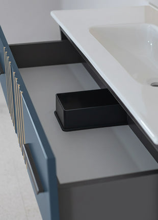 Mobile da bagno sospeso in legno con due cassetti blu petrolio con righe dorate
